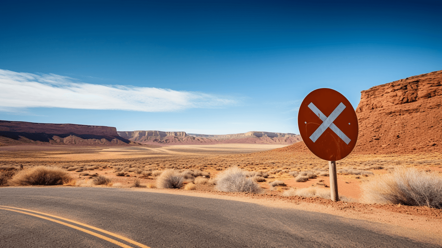 Road with Utah landscape in background and no-entry sign on side of road